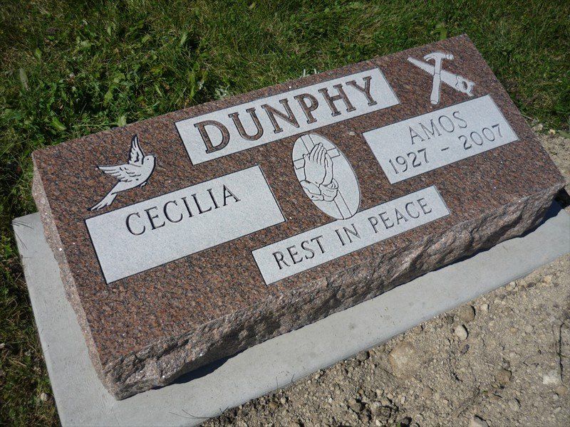 A gravestone for dunphy and cecilia rests in peace