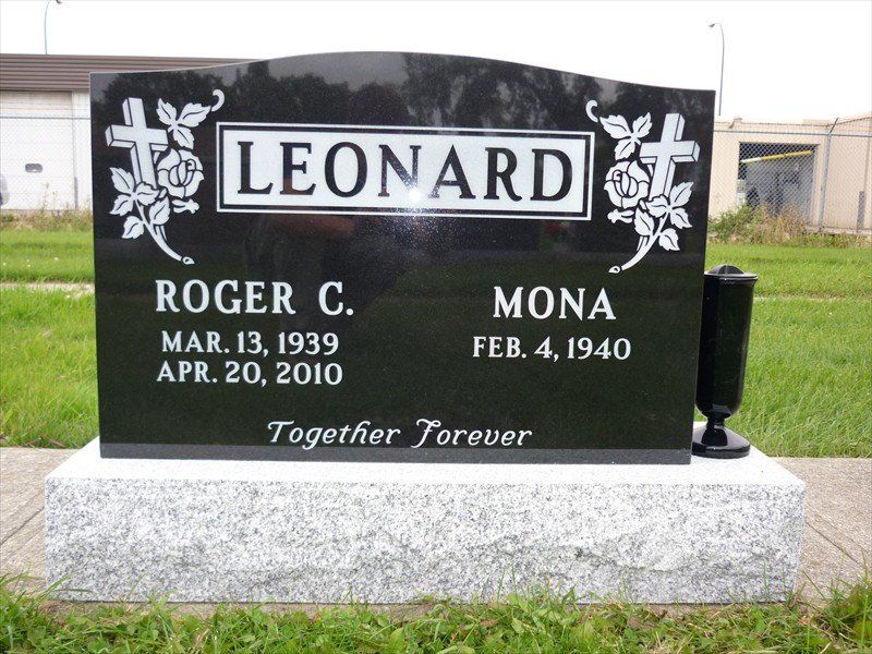 A black gravestone with the name leonard on it