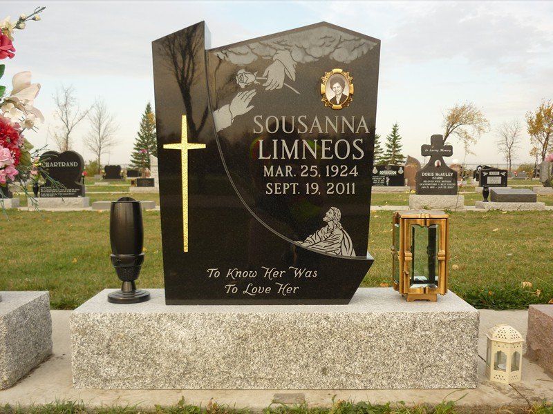 A black gravestone with the name sousanna limneos on it