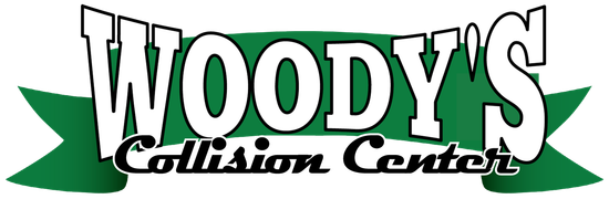 The logo for woody 's collision center is green and white.