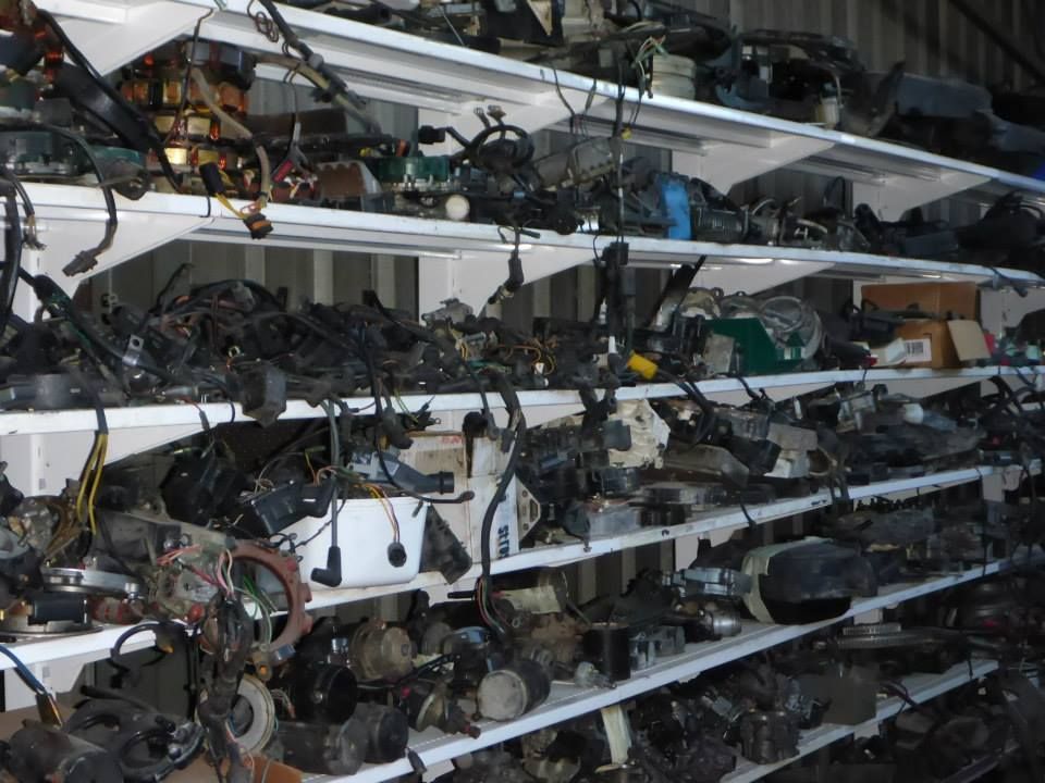 A Warehouse Filled With Lots Of Junk On Shelves — Mark's Outboards & More In Muswellbrook, NSW