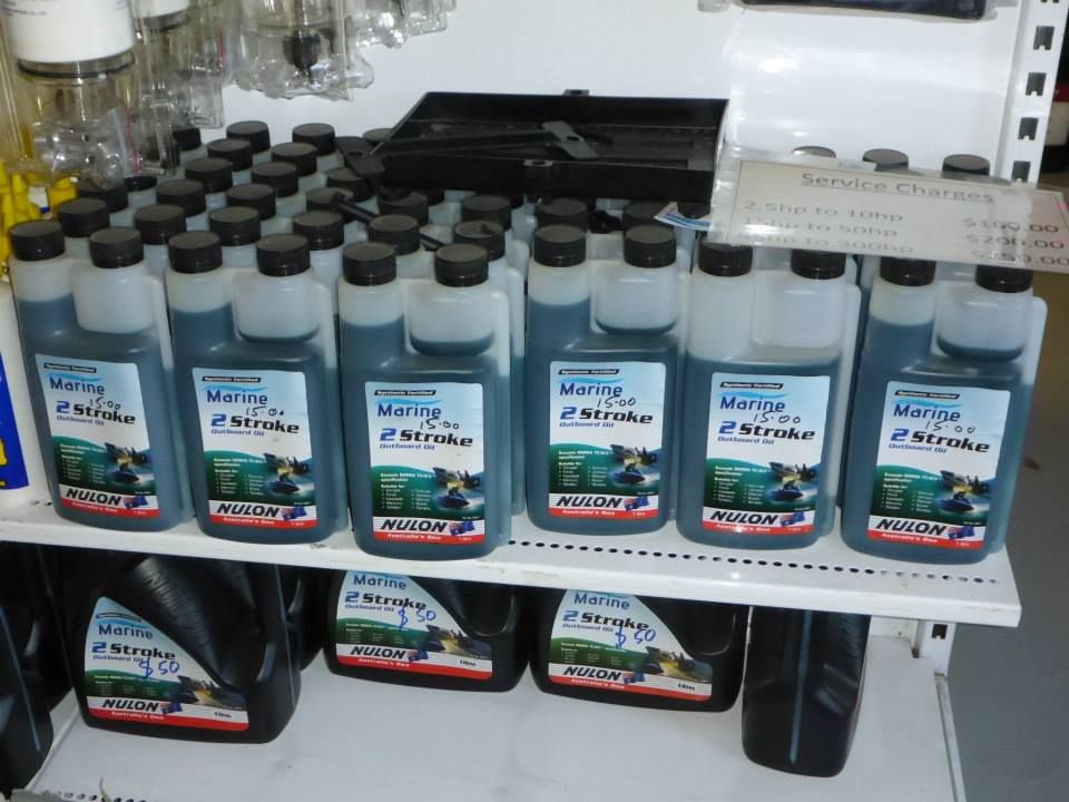A Shelf Filled With Many Bottles Of Motor Oil — Mark's Outboards & More In Central Coast, NSW