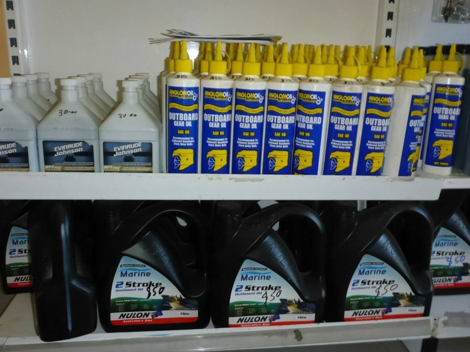 Several Bottles Of Motor Oil Are Lined Up On A Shelf — Mark's Outboards & More In Central Coast, NSW