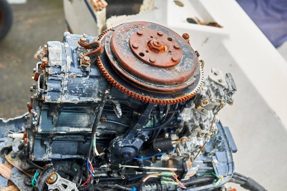 A Close Up Of A Rusty Outboard Motor On A Boat — Mark's Outboards & More In Lake Macquarie, NSW