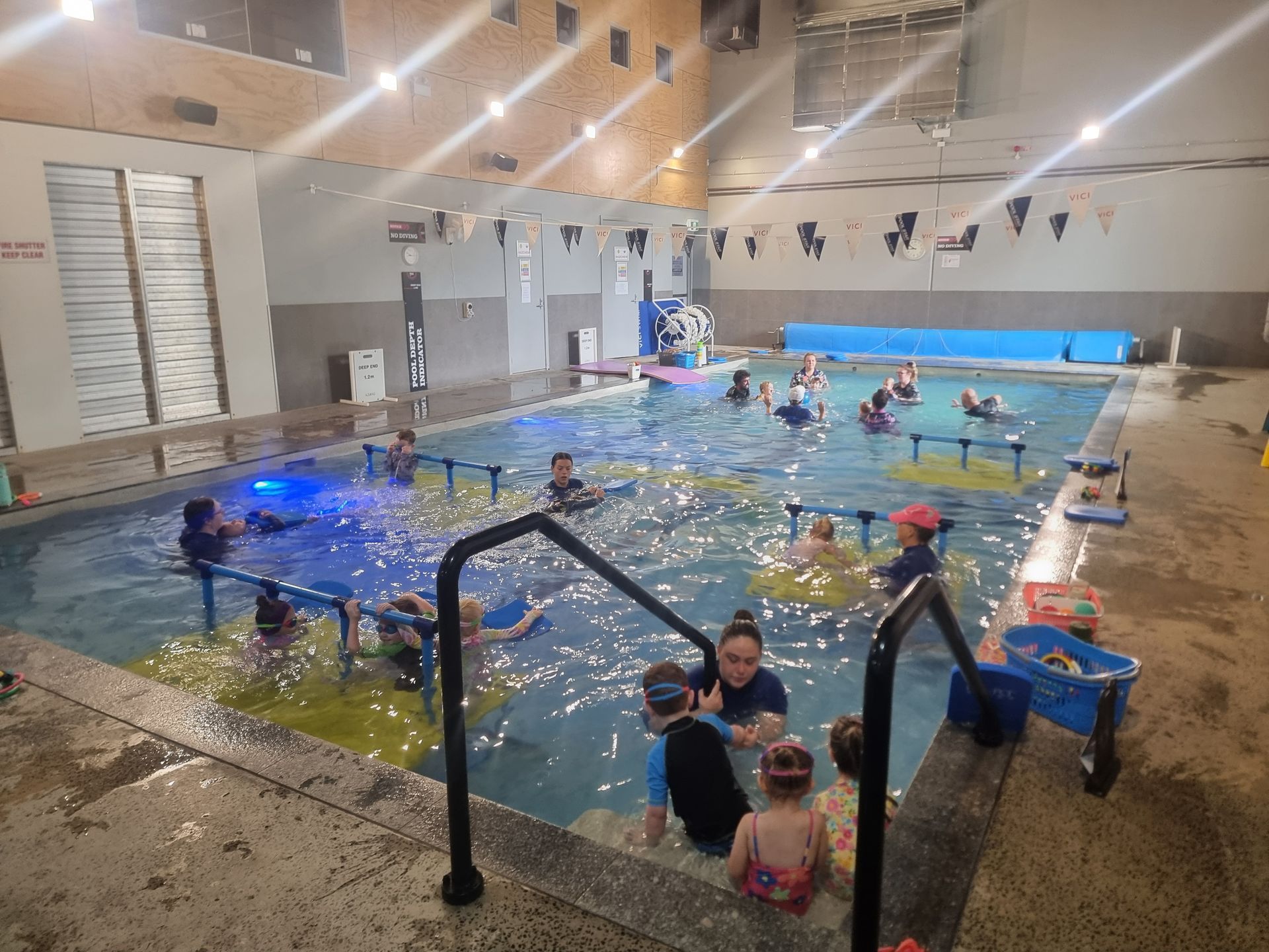 A Group of People Are Playing in a Swimming Pool — DNA Aquatics in Bundaberg, QLD