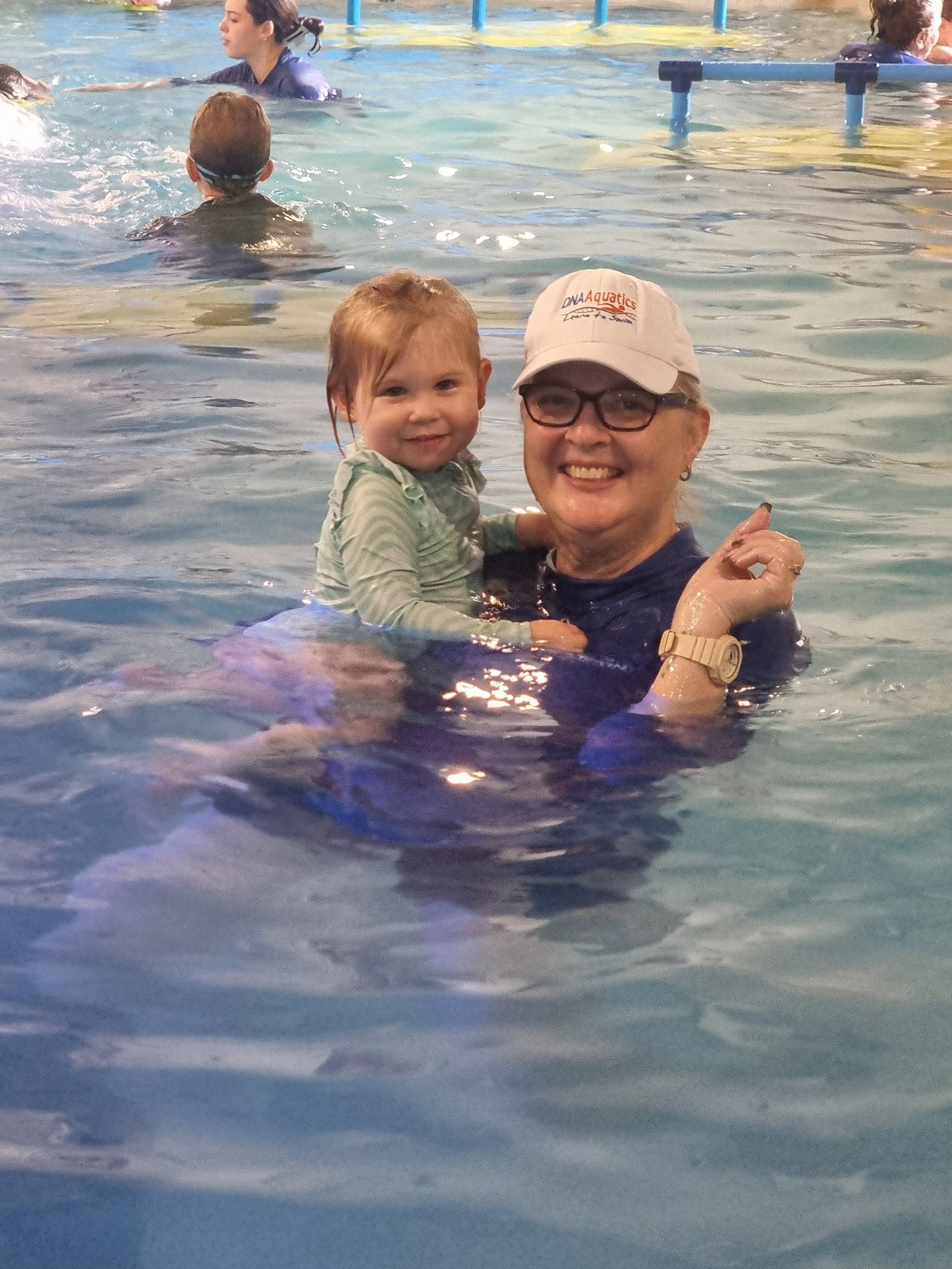 A Group of People Are Swimming in a Swimming Pool — DNA Aquatics in Bundaberg, QLD