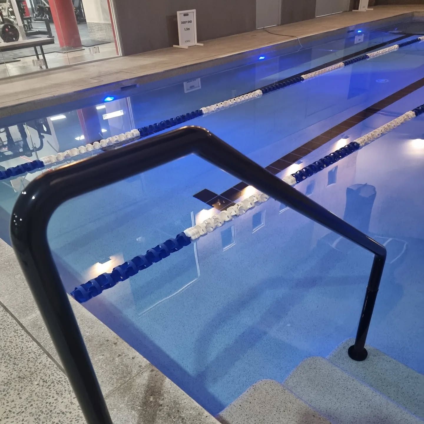 People Are Swimming in a Pool With Flags — DNA Aquatics in Bundaberg, QLD