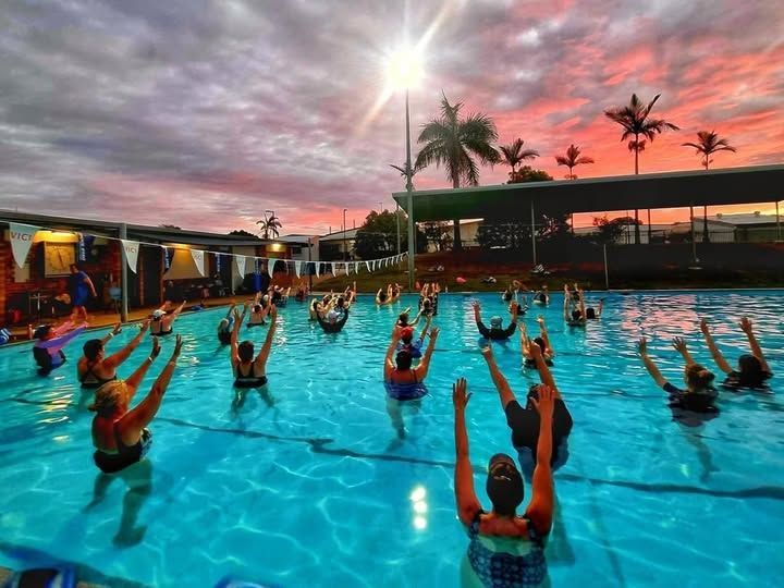 A Group of People Are Swimming in a Large Pool — DNA Aquatics in Bundaberg, QLD