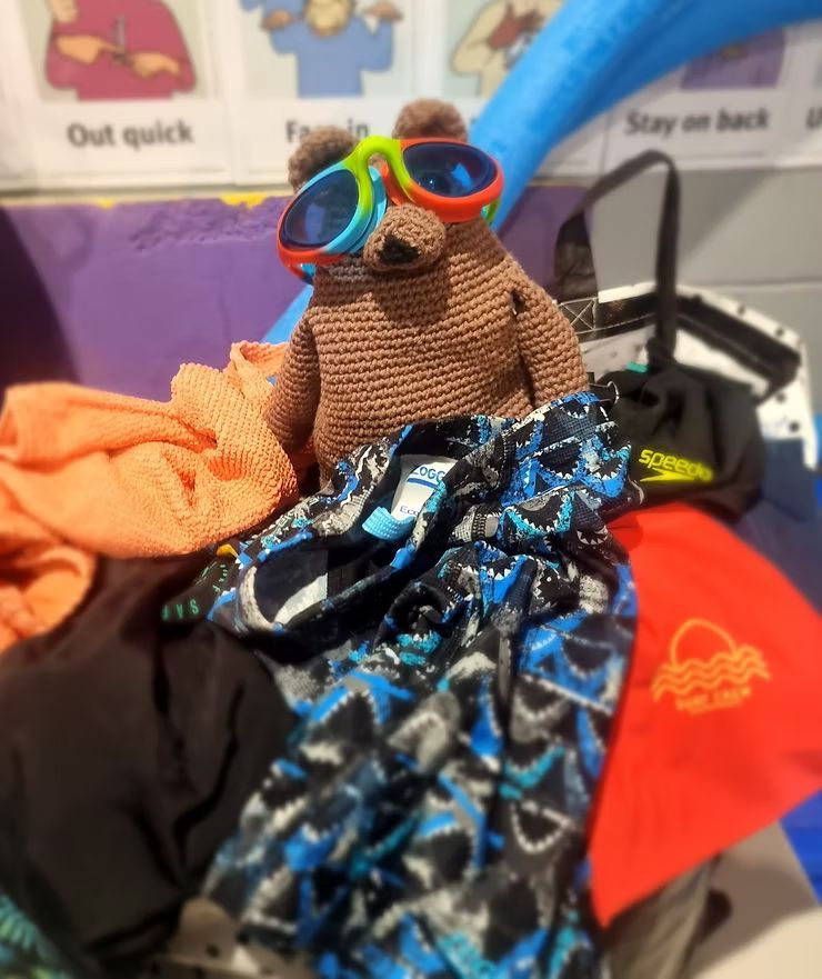 Albie holding spare swimmers