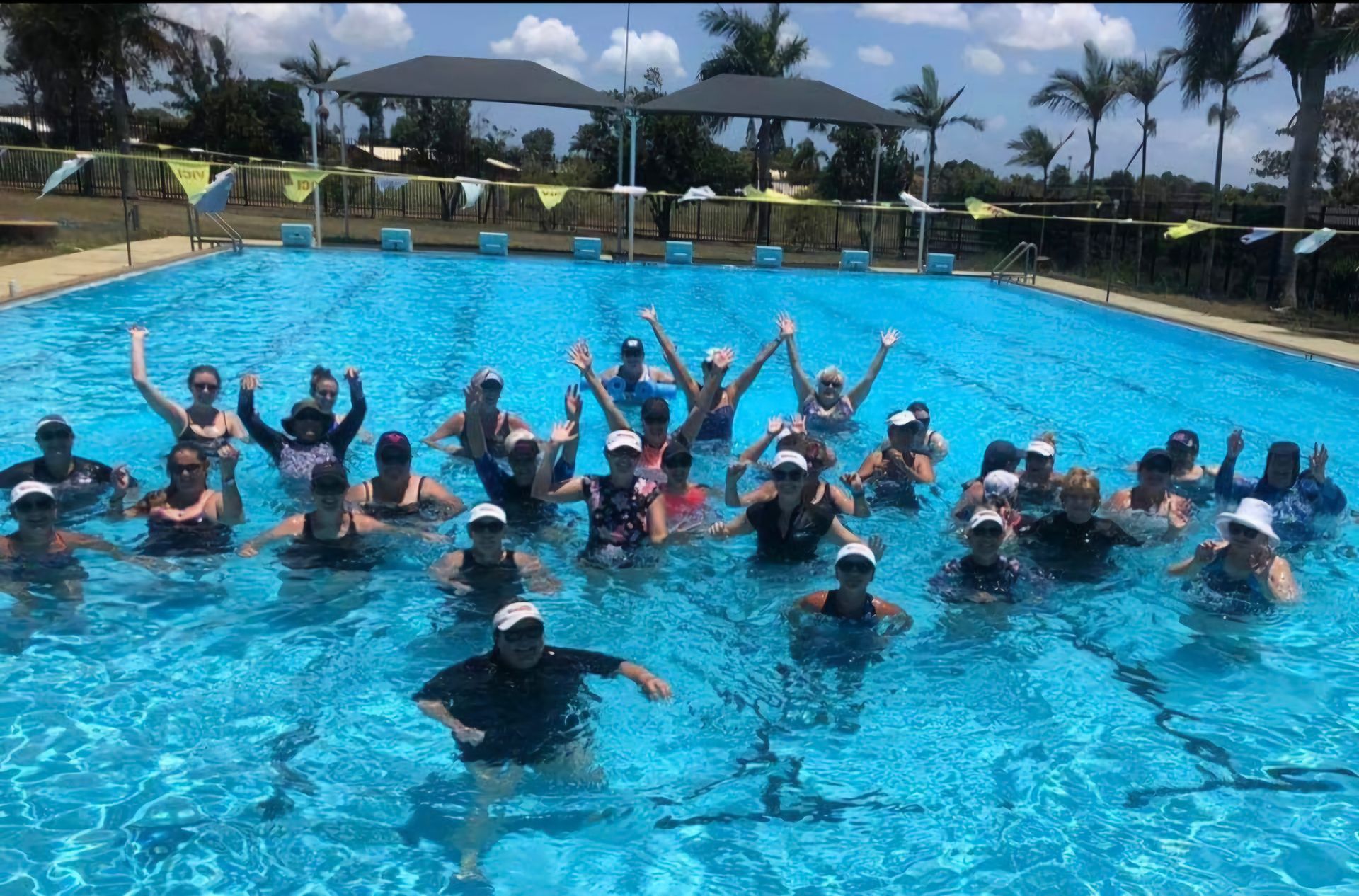 A Group of People Are Swimming in a Swimming Pool — DNA Aquatics in Bundaberg, QLD