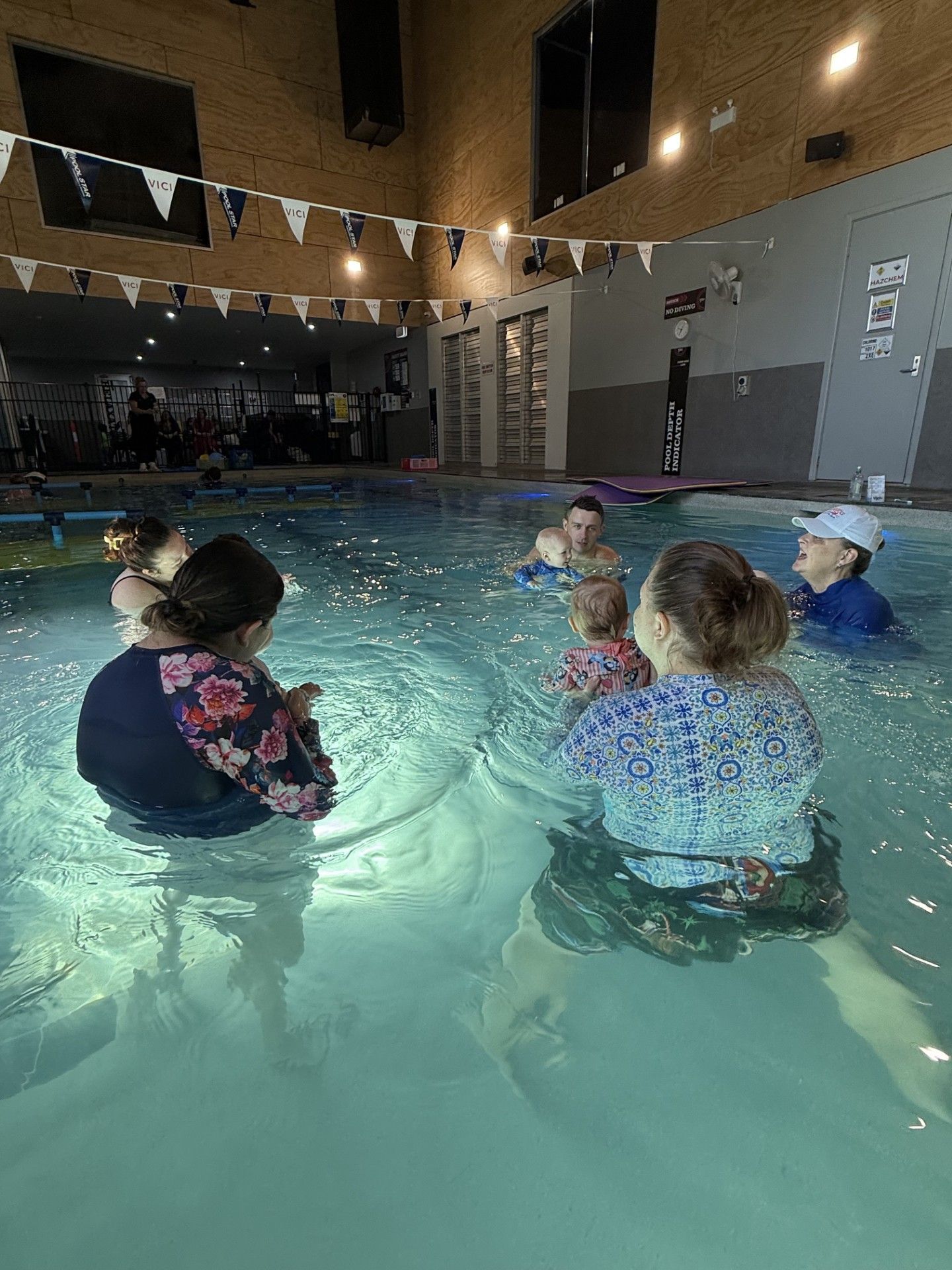 A Group of People Are Playing in a Swimming Pool — DNA Aquatics in Bundaberg, QLD