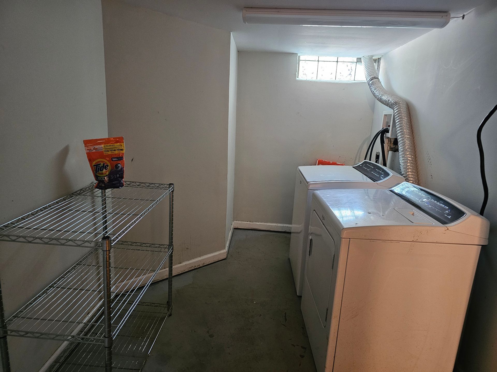 A laundry room with a washer and dryer in it