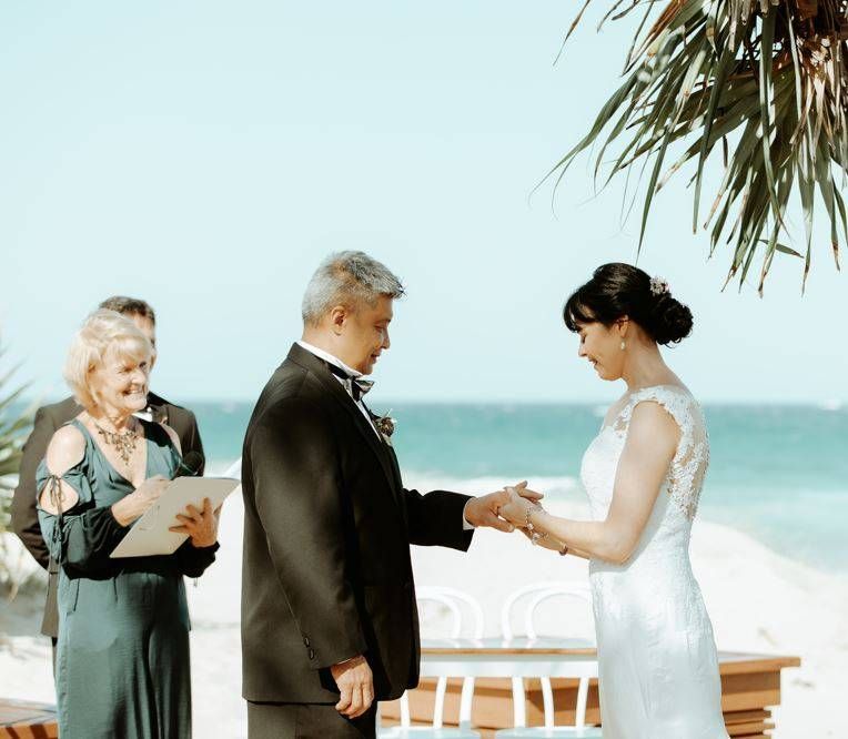 A Bride and Groom Under an Arch at Their Wedding — Vivienne Celebrant - Gold Coast Wedding Celebrant in Casuarina, NSW