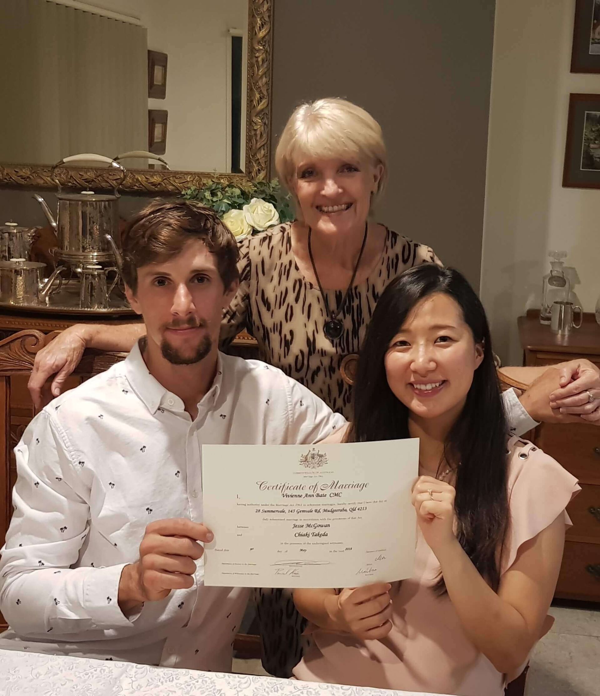 A Bride and Groom Are Cutting Their Wedding Cake — Vivienne Celebrant Gold Coast Wedding Celebrant in Casuarina, NSW