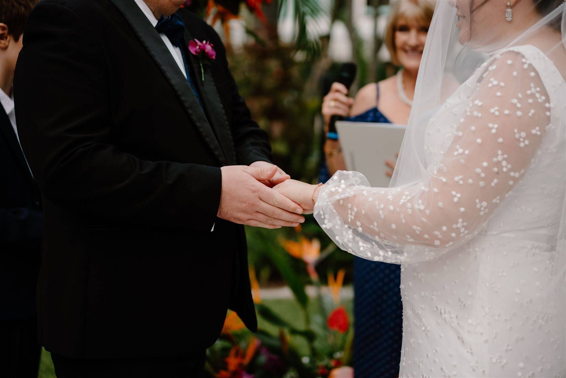 A Bride and Groom Holding Hands While Walking — Vivienne Celebrant - Gold Coast Wedding Celebrant in Mount Tamborine, QLD