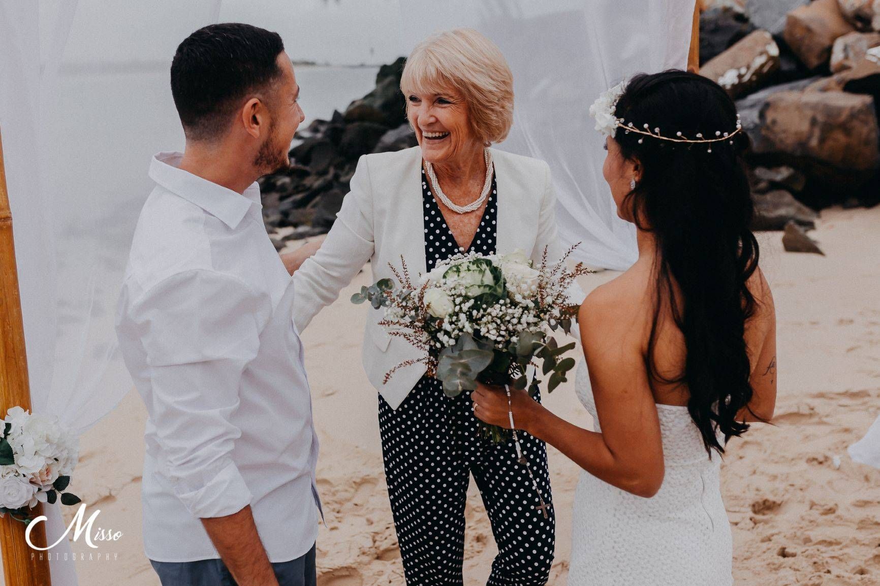 A Bride and Groom Next to Each Other Holding a Bouquet — Vivienne Celebrant - Gold Coast Wedding Celebrant in Mudgeeraba, QLD