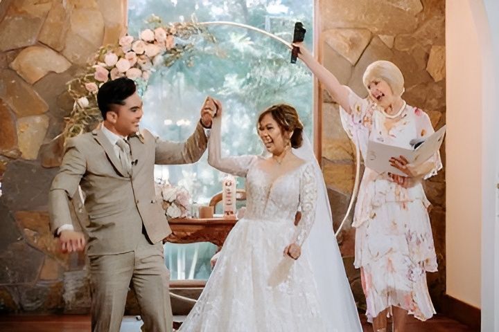 Bride and Groom Smiling During Their Wedding Ceremony — Vivienne Celebrant - Gold Coast Wedding Celebrant in Mudgeeraba, QLD