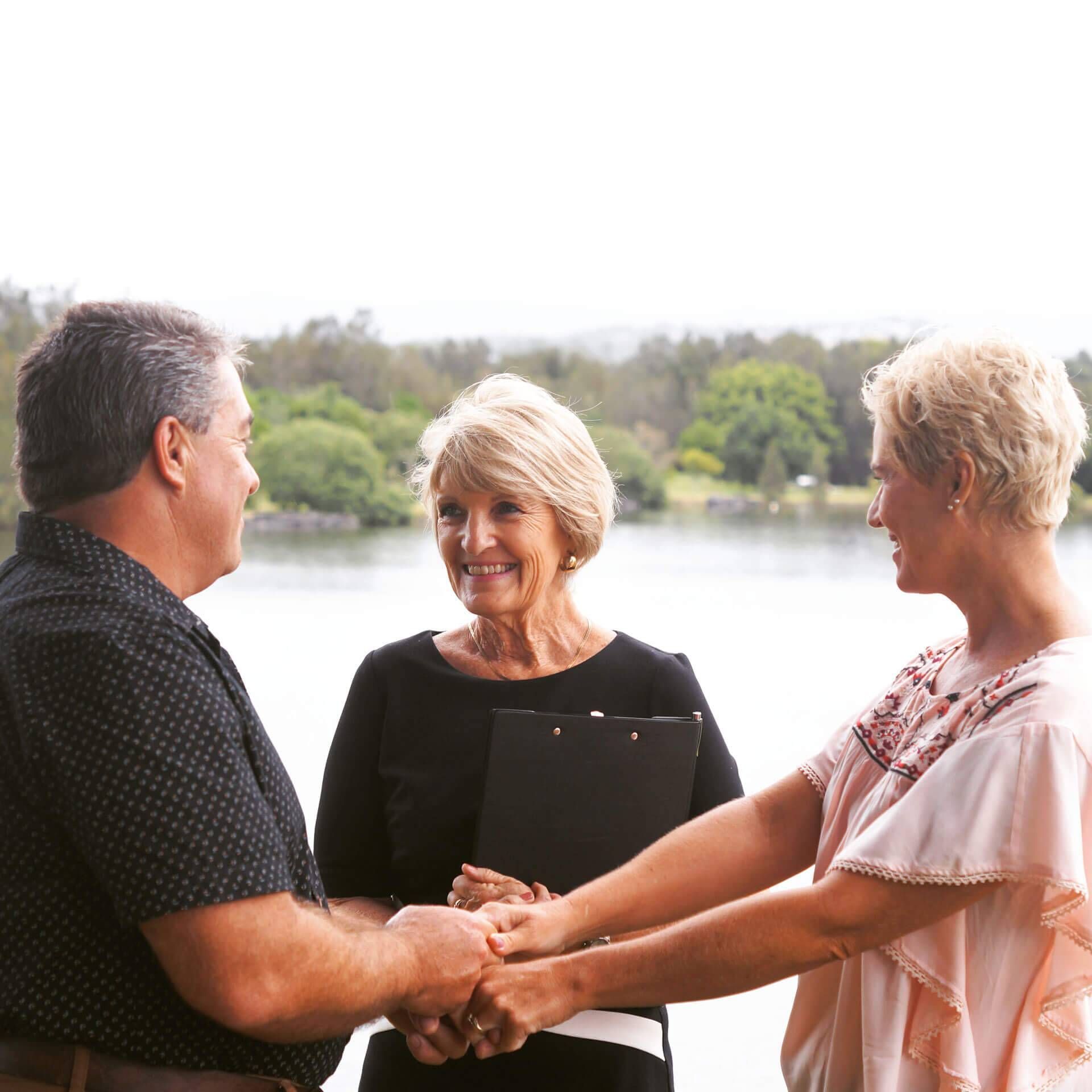A Man and Two Women in Front of A Lake — Vivienne Celebrant - Gold Coast Wedding Celebrant in Mount Tamborine, QLD