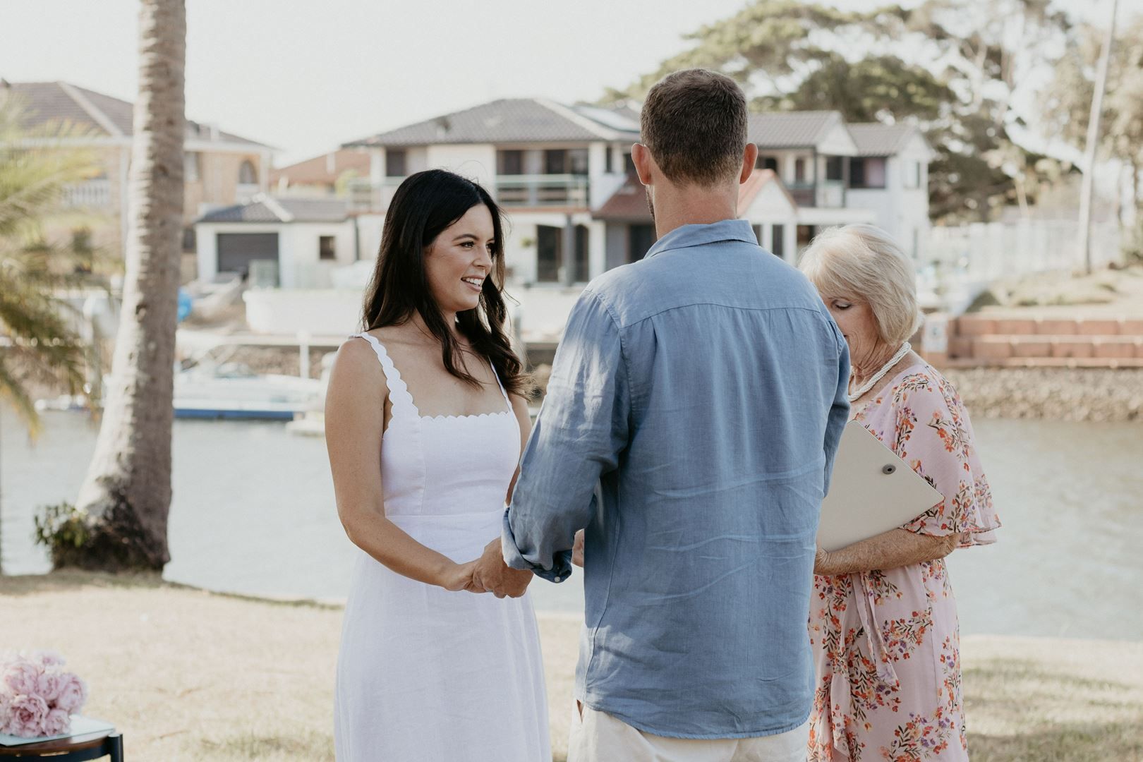 A Man in Blue and A Woman in White Are Holding Hands — Vivienne Celebrant - Gold Coast Wedding Celebrant in Mudgeeraba, QLD