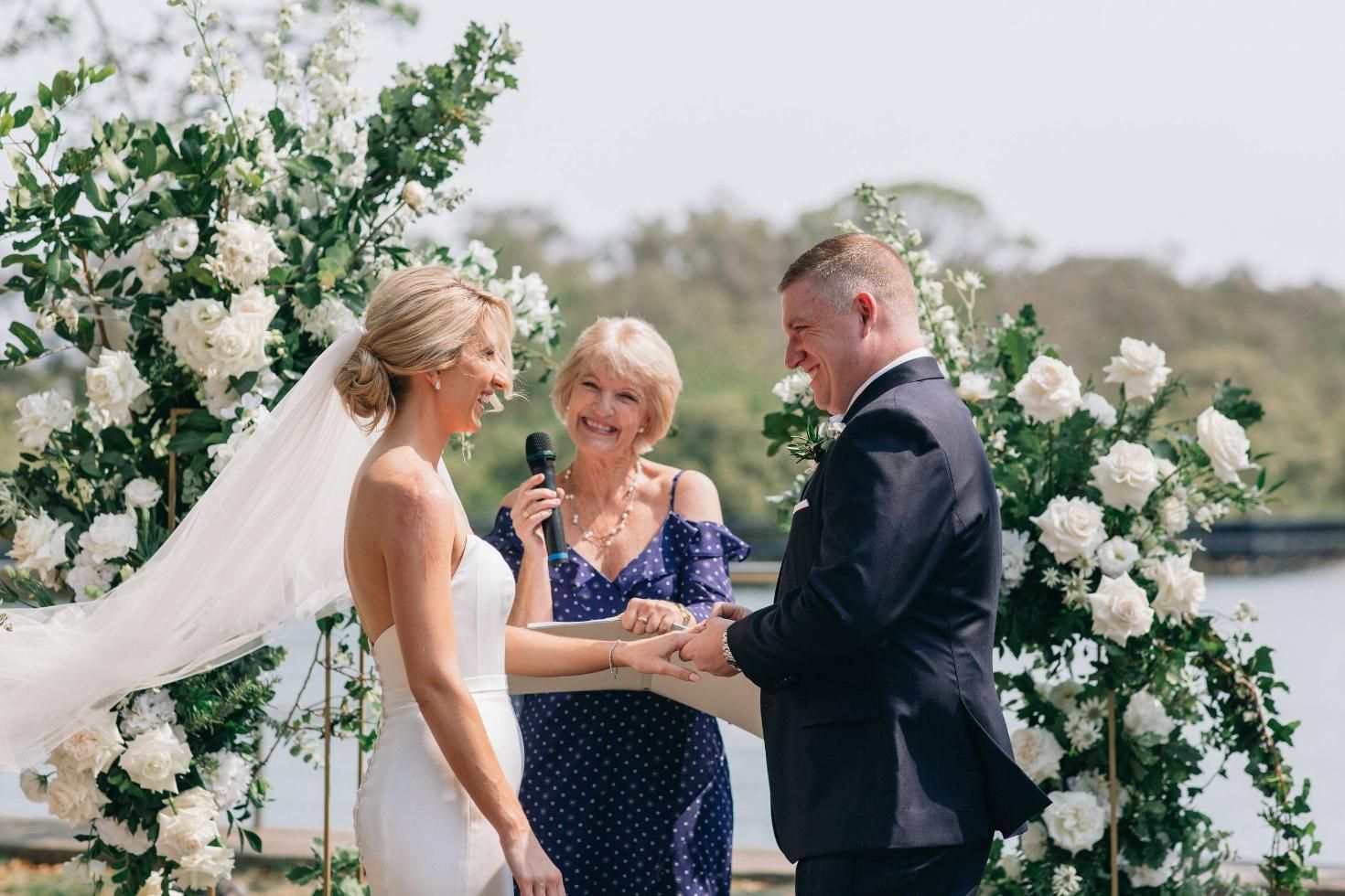 A Bride and Groom Are Getting Married in A Lake — Vivienne Celebrant - Gold Coast Wedding Celebrant in Mudgeeraba, QLD