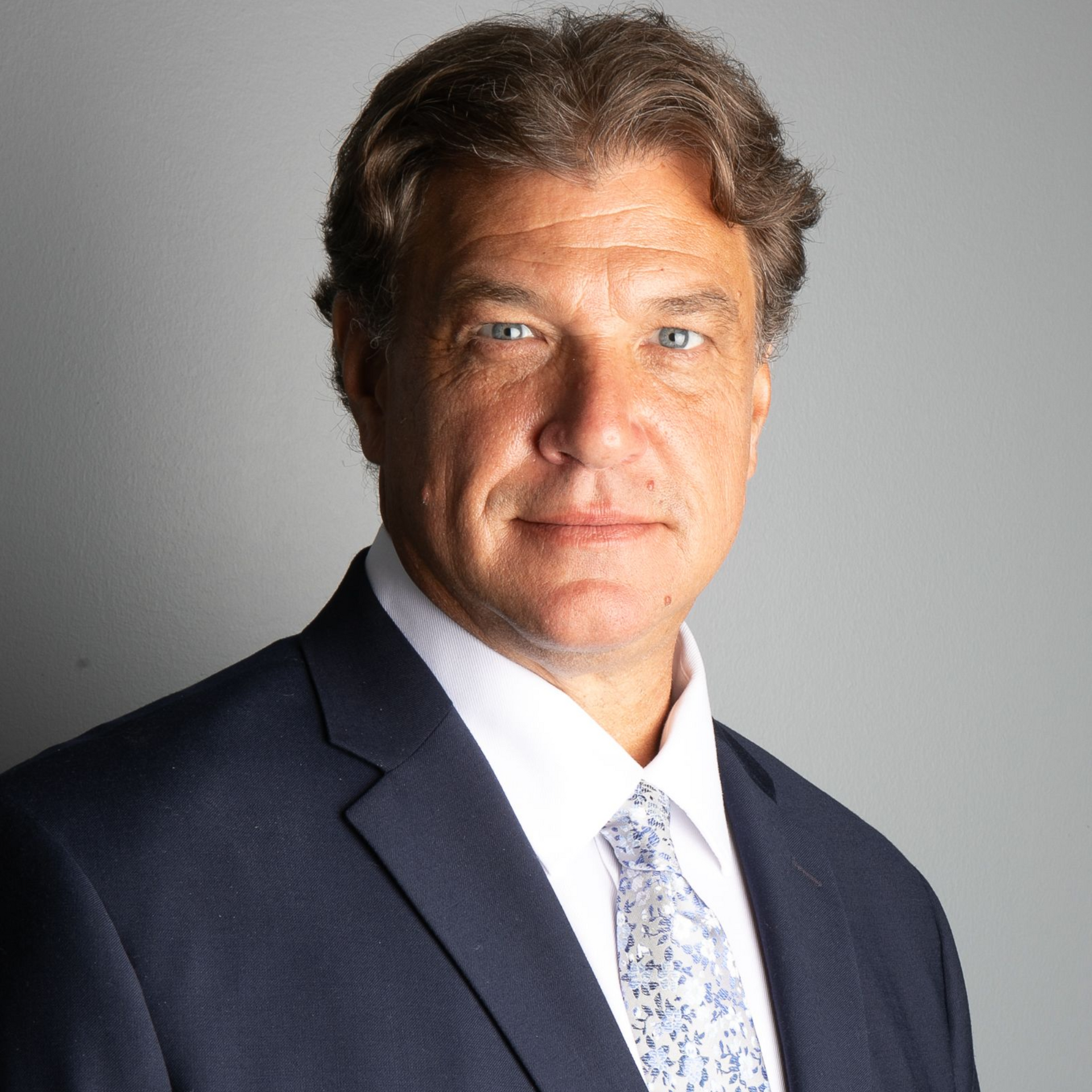 Gavel and block on a black surface, likely in a courtroom setting.