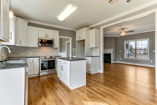 Kitchen With Wooden Floor — Greensboro, NC — Sparks Homes & Home Renovations Inc