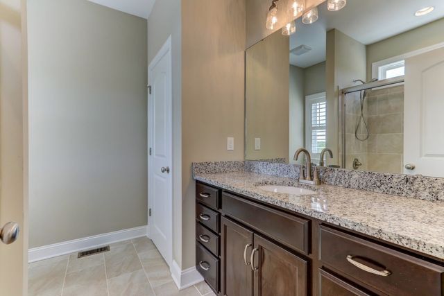 Bathroom With Wood Cabinet — Greensboro, NC — Sparks Homes & Home Renovations Inc