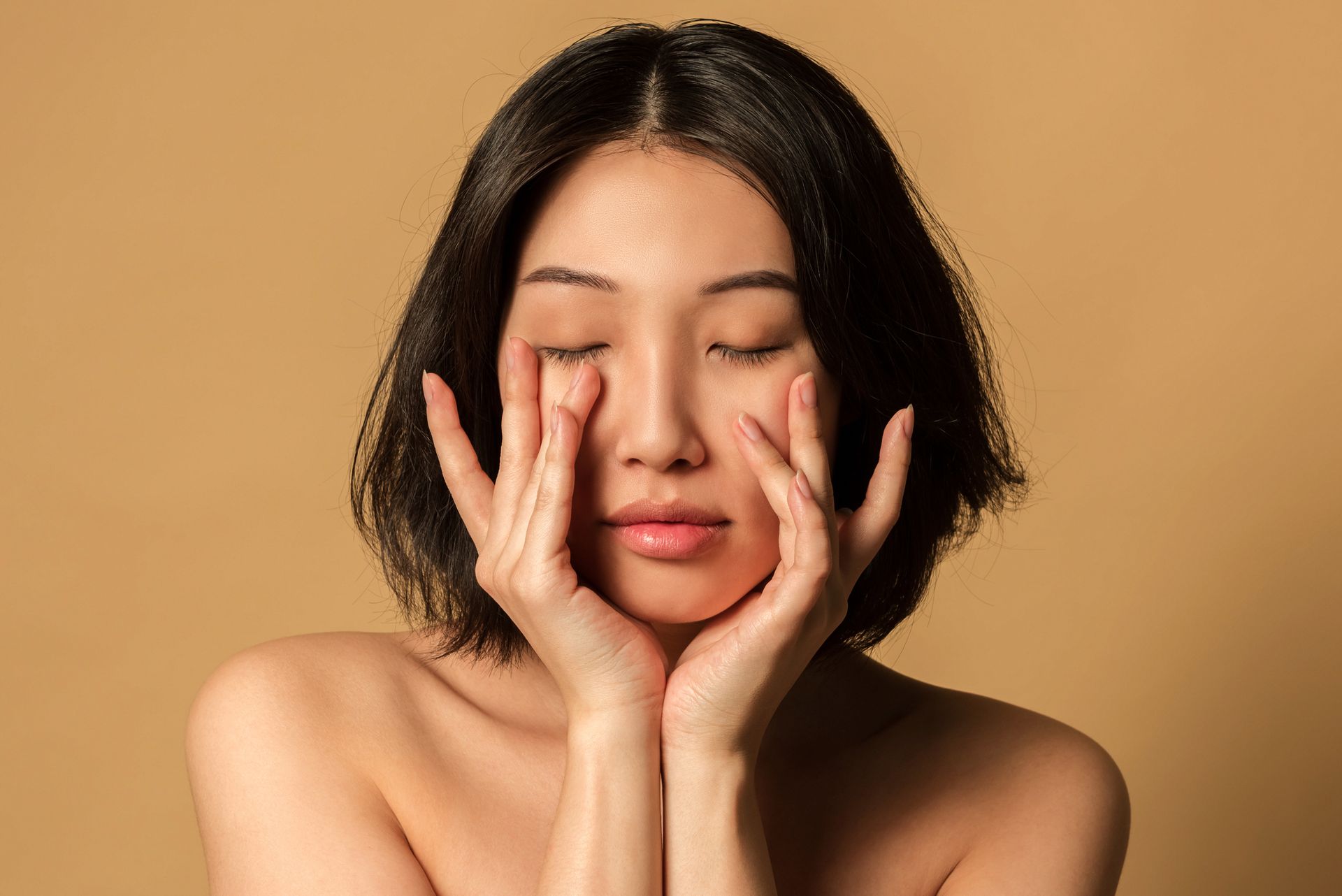 Functional beauty: a serene woman with closed eyes embracing a natural skincare routine.