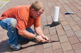 Man Roof Patching — Roofing Services in Dr. Santa Maria, CA
