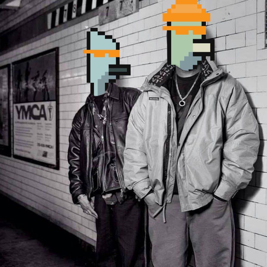 Two men are standing next to each other in front of a ymca sign