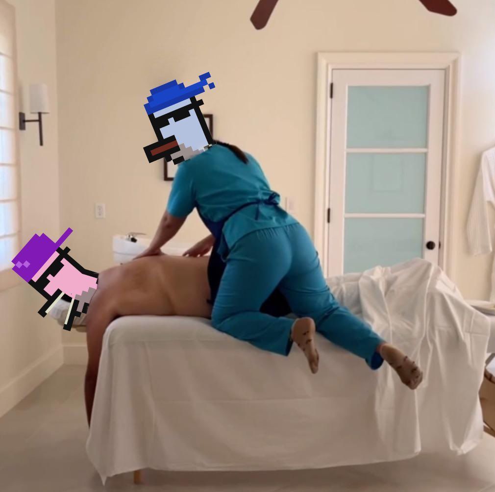 A woman in scrubs is giving a man a massage