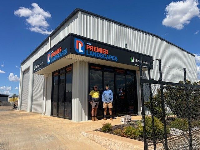 Two men standing in front of Premier Landscapes building — Dubbo Premier Landscapes in Dubbo, NSW