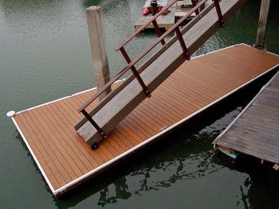A wooden dock with stairs leading up to it in the water