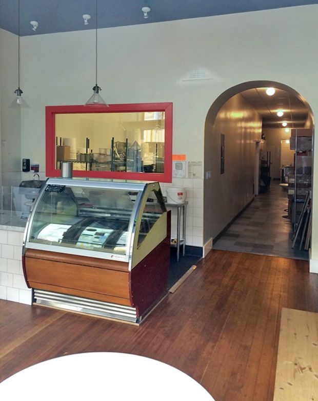 A display case in a store with a red frame