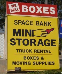 Yellow sign for Space Bank Mini Storage: