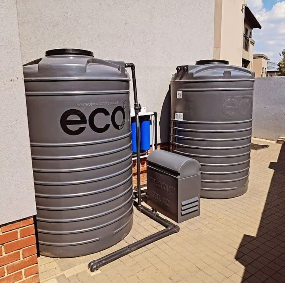 Two gray water tanks with the word eco on them