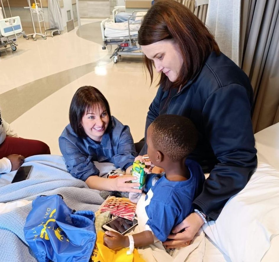 Megan Carvill Oral Hygienist talking to a young boy in Pretoria.