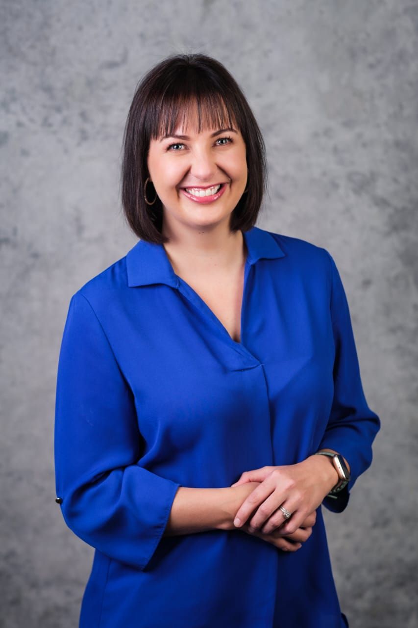 Megan Carvill, Oral Hygienist in Pretoria East smiling at the camera.