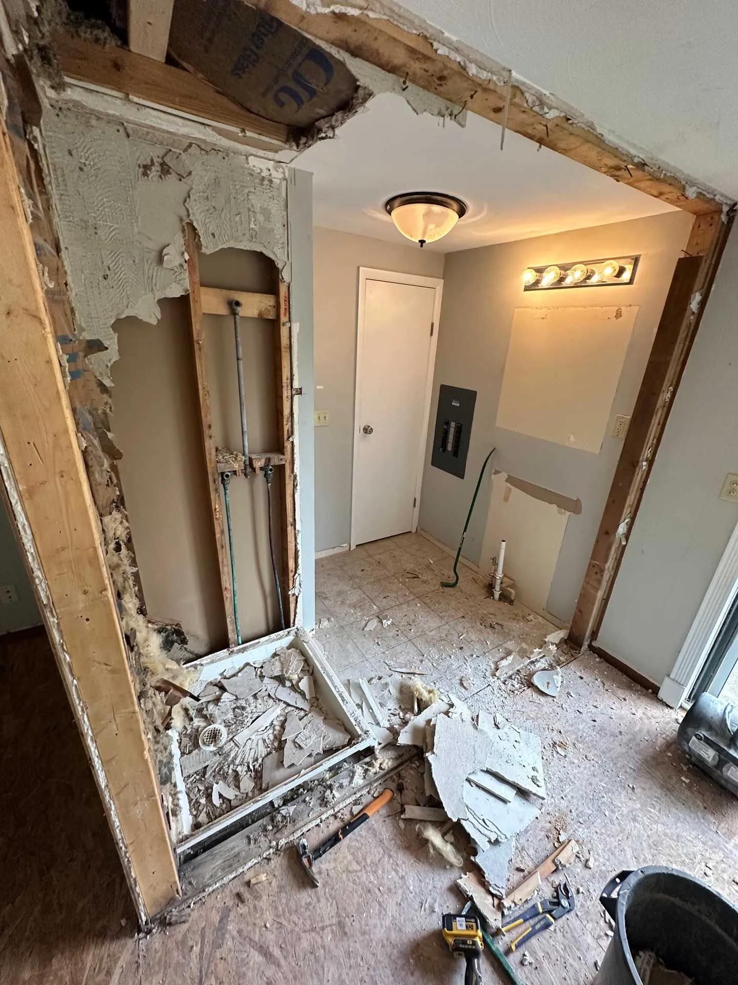 A room that is being remodeled with a hole in the wall.