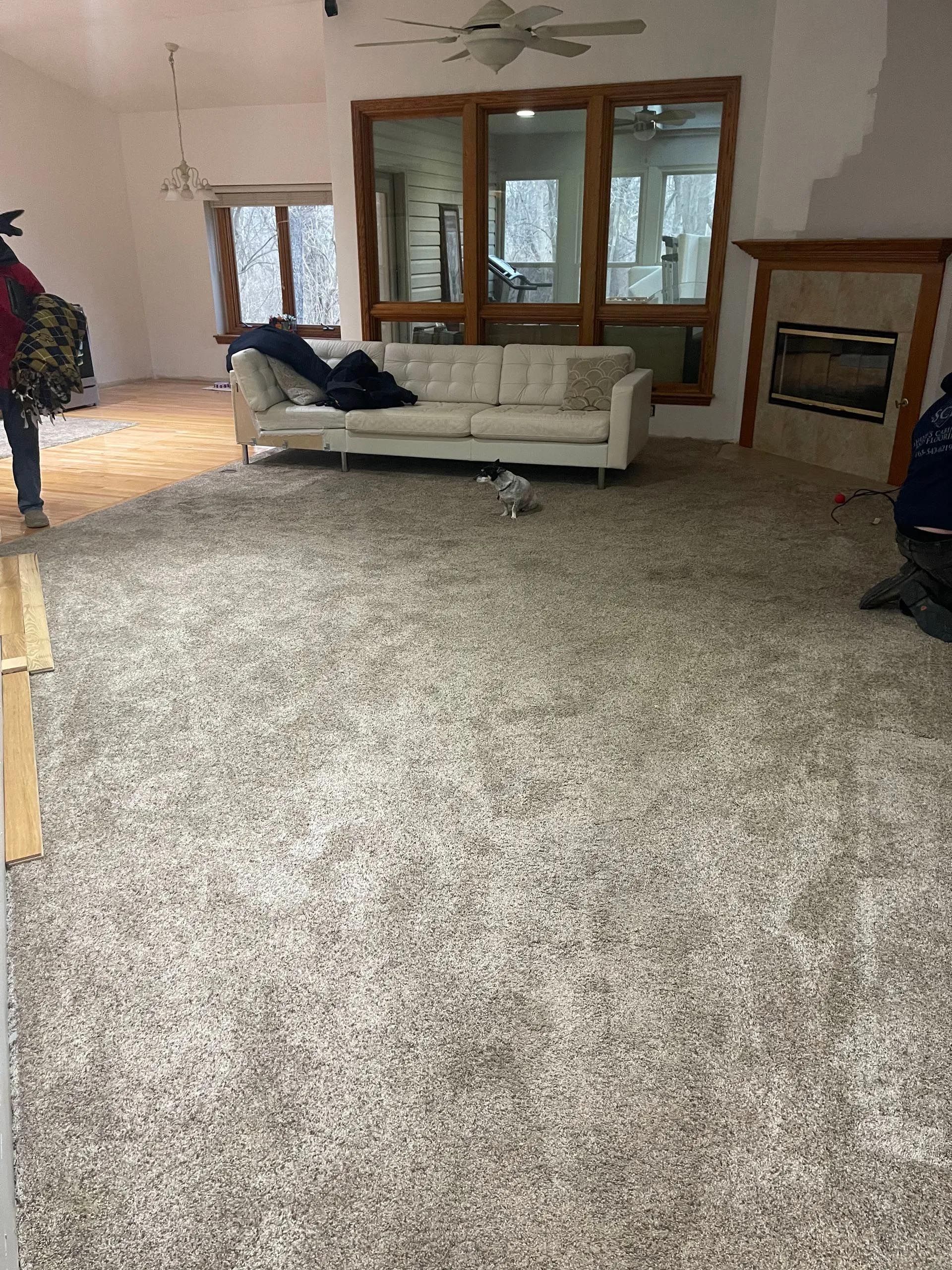 A living room with a couch and a fireplace