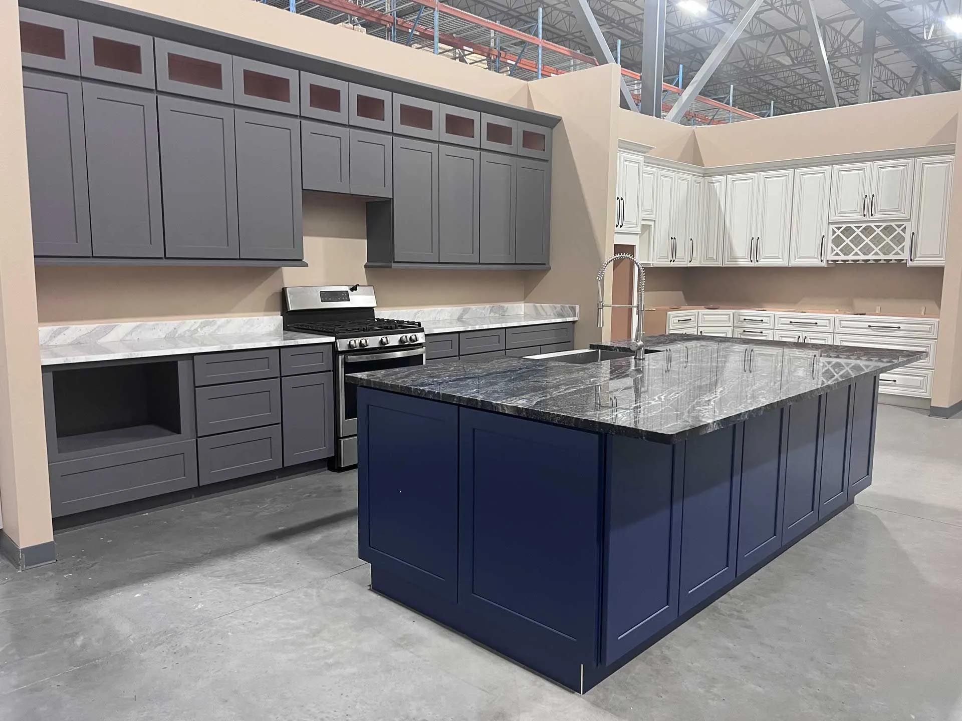 A kitchen with a large island in the middle of it.