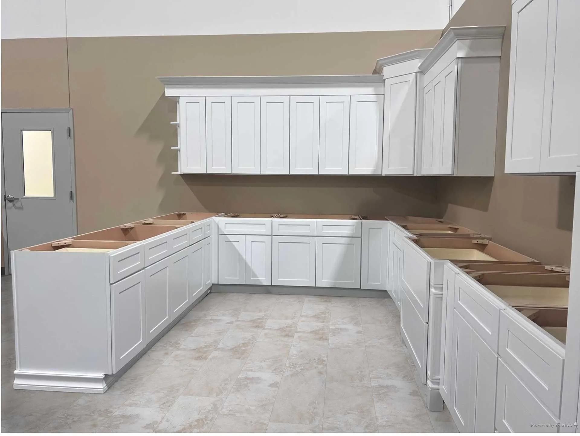 A computer generated image of a kitchen with white cabinets