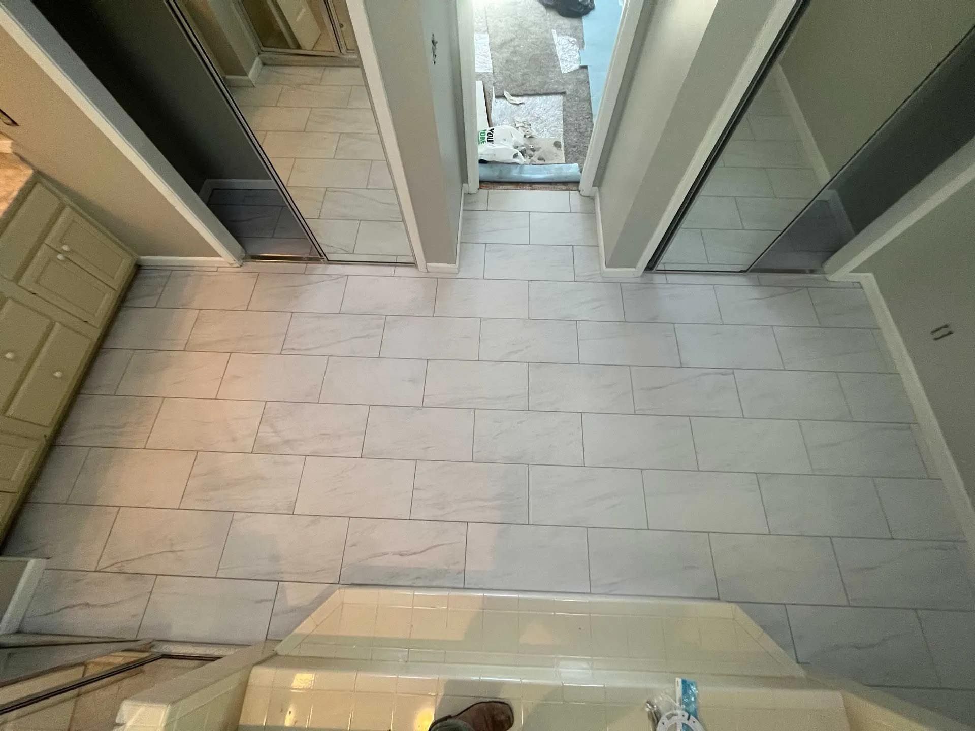 An aerial view of a bathroom with a tiled floor