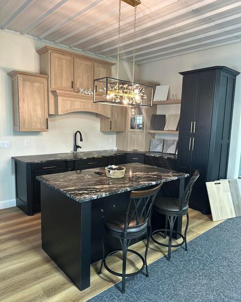 A bathroom with a bathtub , sink , and mirror.
