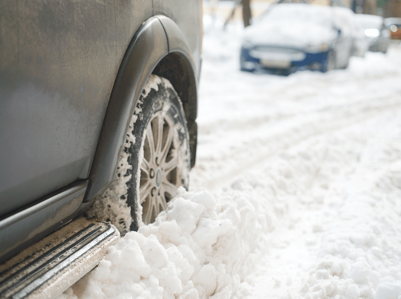 Vehicle with a flat tire in the snow