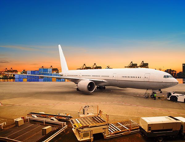 A large passenger jet is parked on the tarmac at an airport.