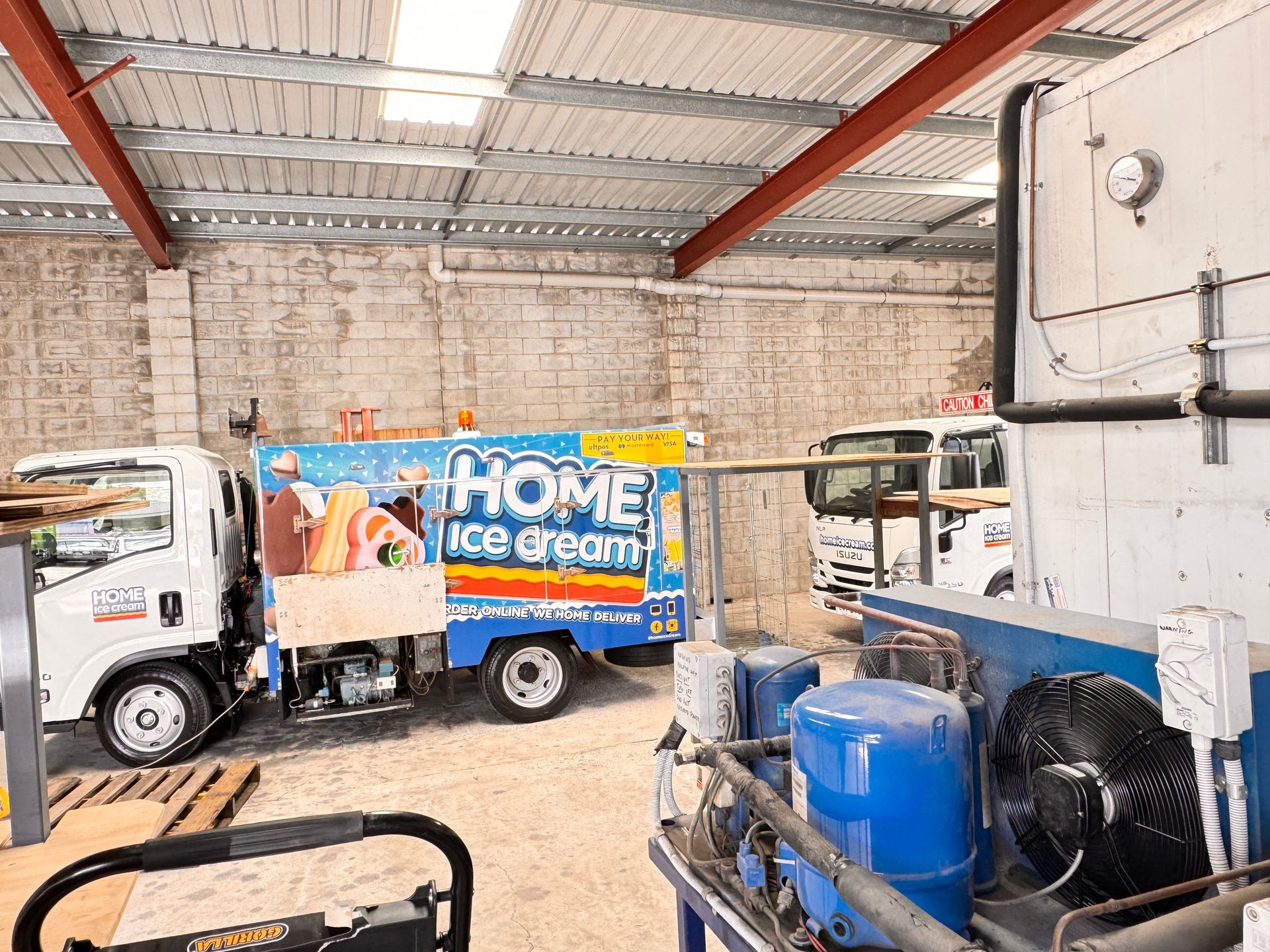 A Chef is Looking at a Clipboard in a Kitchen — Chillzone Refrigeration and Air Conditioning in Bribie Island, QLD