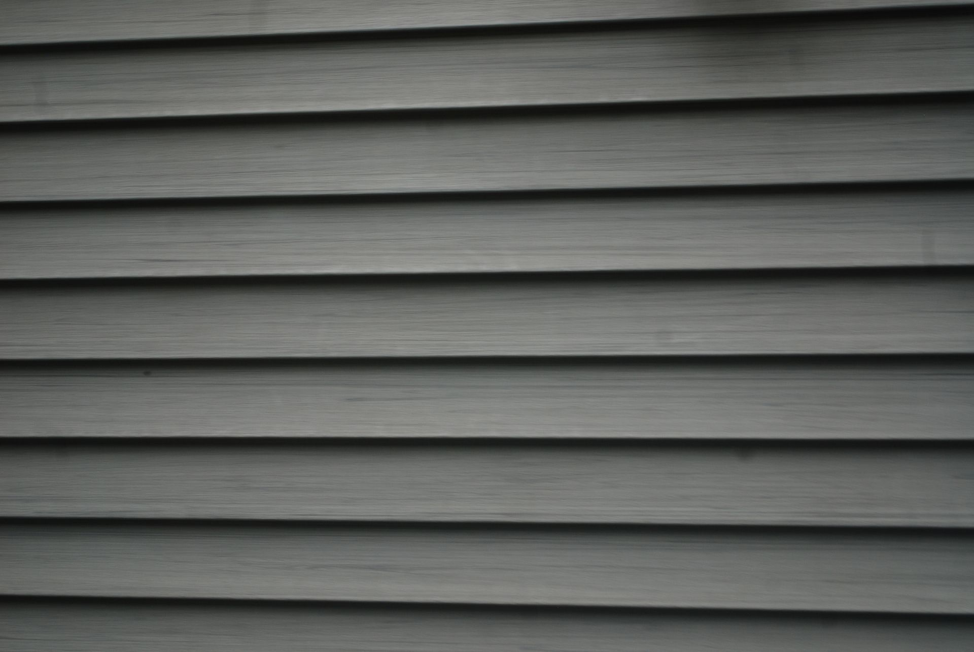 Gray horizontal siding on a building exterior.
