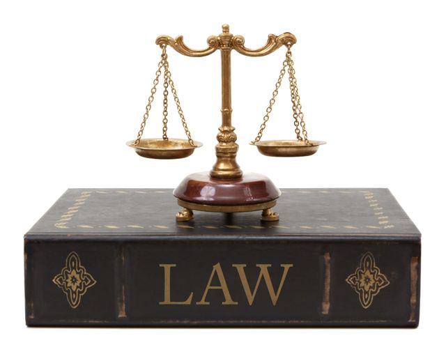 Scale Of Justice And Book Of Law — Utica, NY — R. Robert Sossen, Jr. Attorney at Law