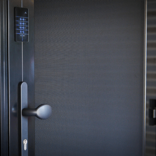 Dark gray door with keypad, handle, and keyhole.